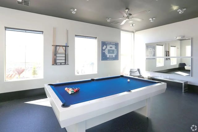 Pool table with balls and cues playing area at The Republic in Reno Student Accommodation