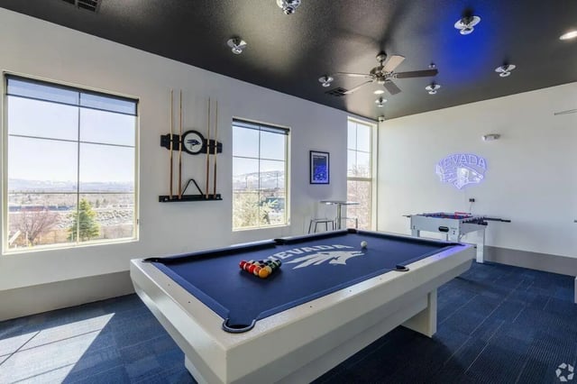 Pool table foosball table neon sign playing area at The Republic in Reno Student Accommodation