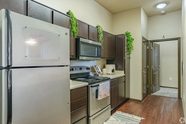 Stainless steel fridge microwave stove cabinets kitchen at The Republic in Reno Student Accommodation
