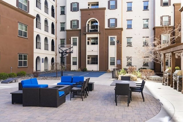 Blue couches basketball court fire pit outdoor area at The Republic in Reno Student Accommodation