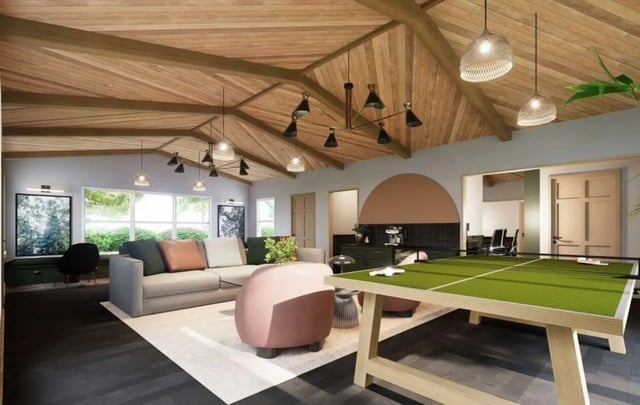 Ping pong table couches and chairs living room at Market 100 in Statesboro Student Accommodation