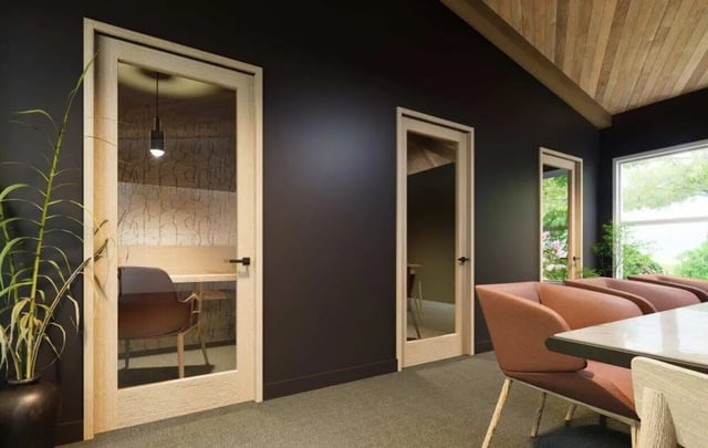 Glass door booths and lounge seating common area at Market 100 in Statesboro Student Accommodation