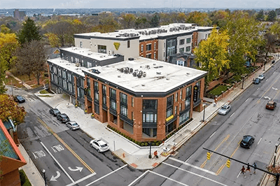 Modern brick student housing complex with cars exterior at The View on Pavey Square in Columbus Student Accommodation