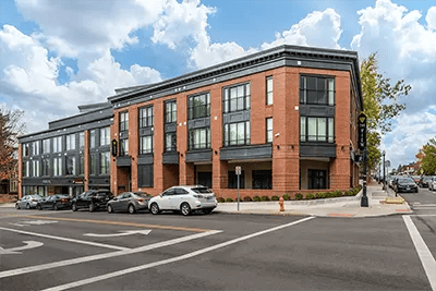 Modern brick building with cars exterior at The View on Pavey Square in Columbus Student Accommodation
