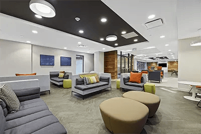 Modern sofas ottomans lounge area living room at The View on Pavey Square in Columbus Student Accommodation