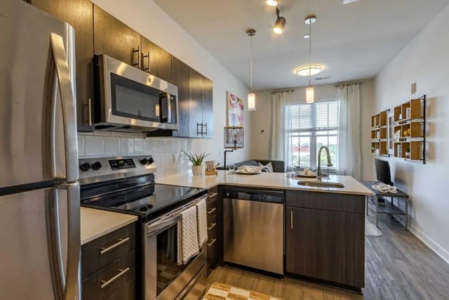 Stainless steel appliances modern cabinets countertops sink kitchen at Hoffler Place in Charleston Student Accommodation