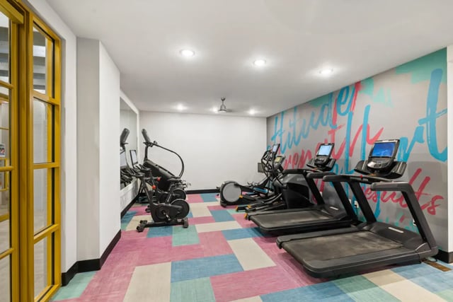 Treadmills ellipticals stationary bike gym room at Hoffler Place in Charleston Student Accommodation