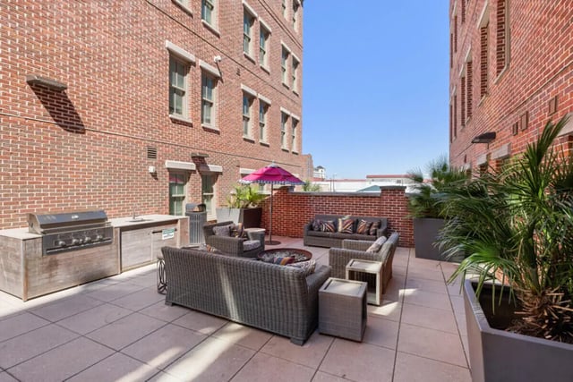 Grill seating area with fire pit patio exterior at Hoffler Place in Charleston Student Accommodation