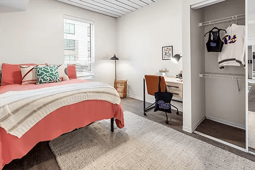 Bed desk closet and clothing bedroom study area at HERE Pittsburgh in Pittsburgh Student Accommodation
