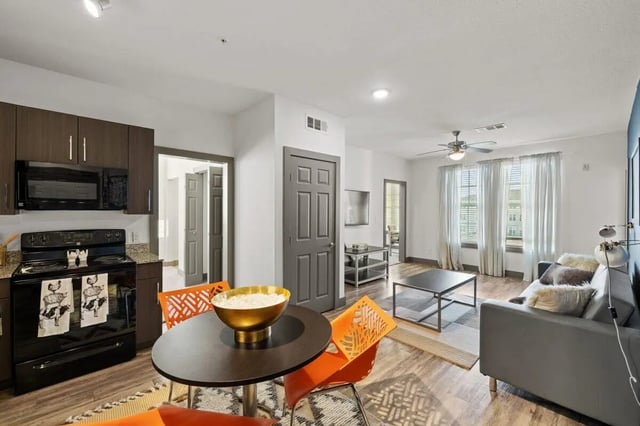 Kitchen dining area with sofa living room at Holleman Crossing in College Station Student Accommodation