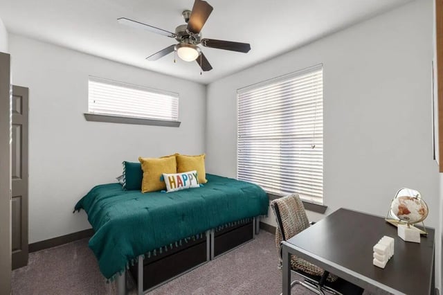 Bed desk chair and globe bedroom at Holleman Crossing in College Station Student Accommodation