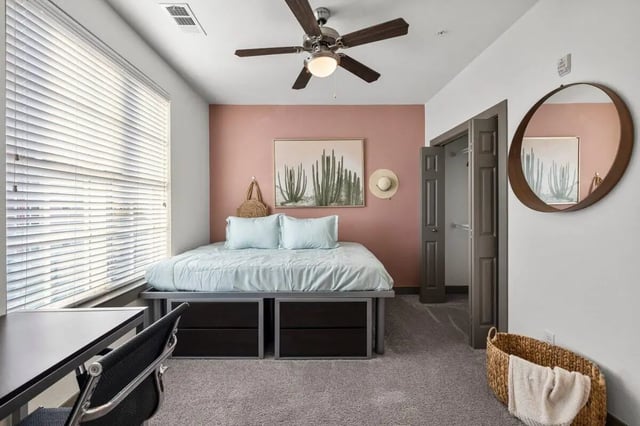 Bed desk closet ceiling fan mirror bedroom at Holleman Crossing in College Station Student Accommodation