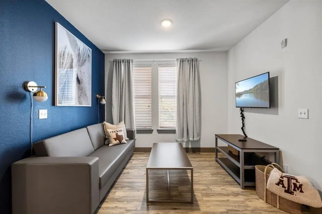 Sofa coffee table and television living room at Holleman Crossing in College Station Student Accommodation