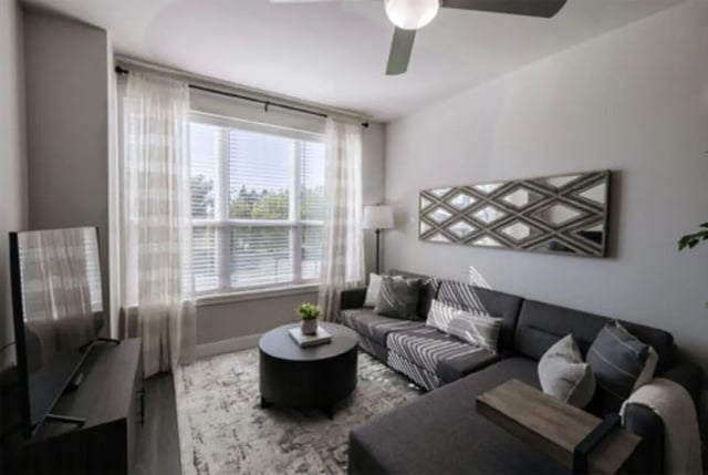 Sectional sofa coffee table rug mirror living room at The Carlton House in Lubbock Student Accommodation