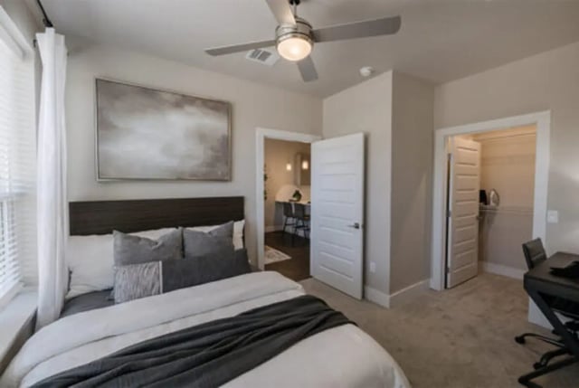 Bed art ceiling fan and desk Bedroom at The Carlton House in Lubbock Student Accommodation