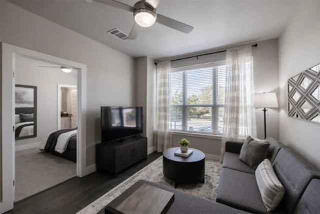 Sofa television coffee table ceiling fan living room at The Carlton House in Lubbock Student Accommodation