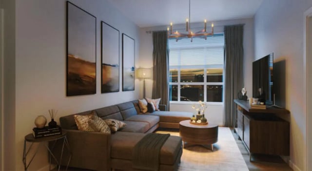 Modern living room with sectional sofa and TV living room at The Carlton House in Lubbock Student Accommodation