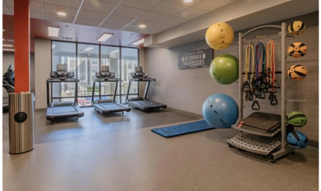 Treadmills exercise balls resistance bands gym gym at The Carlton House in Lubbock Student Accommodation