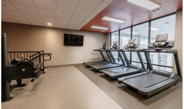 Treadmills and weight machine gym at The Carlton House in Lubbock Student Accommodation