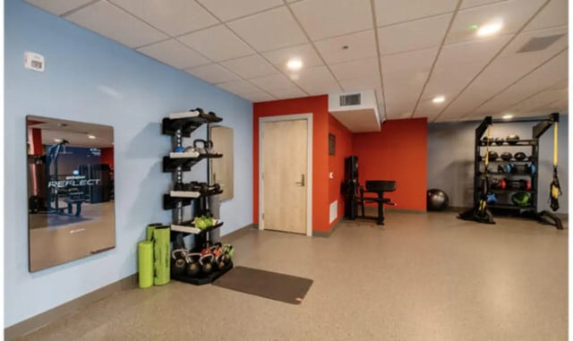 Weights mirror and exercise equipment gym at The Carlton House in Lubbock Student Accommodation