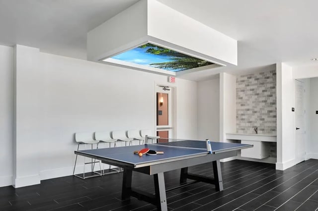Ping pong table with paddles and balls communal area at The View on the Square in San Marcos Student Accommodation