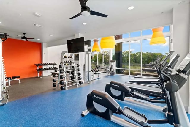 Elliptical machines weight racks bright wall gym at The View on the Square in San Marcos Student Accommodation