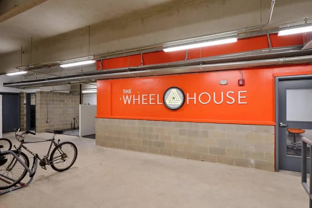 Bicycles and bike rack near The Wheel House exterior at The View on the Square in San Marcos Student Accommodation