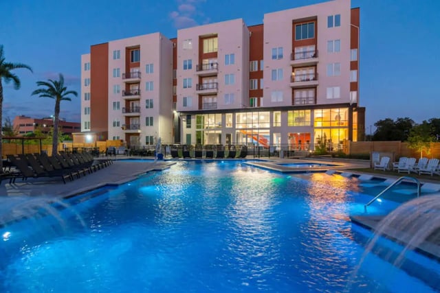 Swimming pool deck with lounge chairs exterior at The View on the Square in San Marcos Student Accommodation