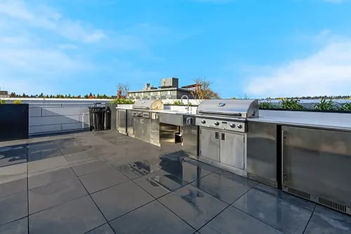 Outdoor stainless steel grills and counters kitchen at HERE Seattle in Seattle Student Accommodation
