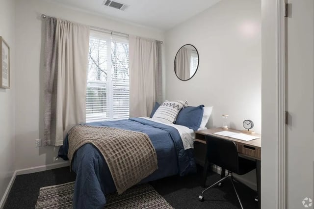 Bed desk mirror and clock bedroom at Paloma Kent in Kent Student Accommodation