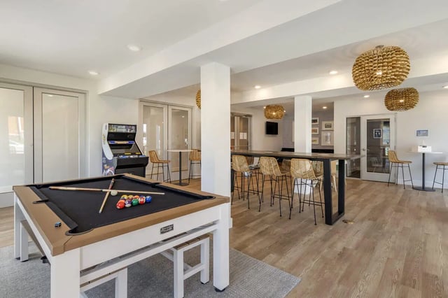 Billiard table arcade machine high tables and stools communal area at Paloma Raleigh in Raleigh Student Accommodation