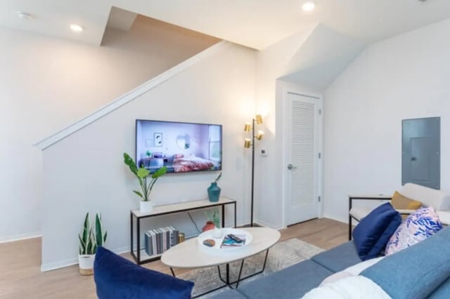 Living room with sofa tv and coffee table living room at Paloma Raleigh in Raleigh Student Accommodation