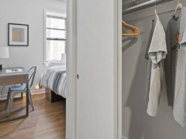Desk chair bed closet with clothes Bedroom at The Legacy at Powelton Village in Philadelphia Student Accommodation