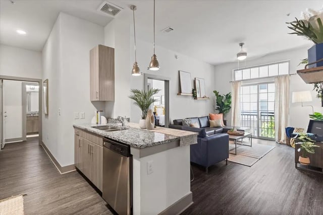 Modern kitchen counter with living area furniture living room at Paloma West Midtown in Atlanta Student Accommodation