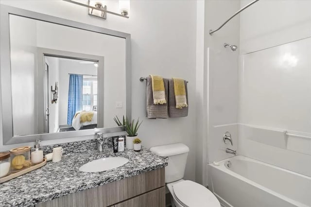 Granite countertop sink toilet tub shower Bathroom at Paloma West Midtown in Atlanta Student Accommodation