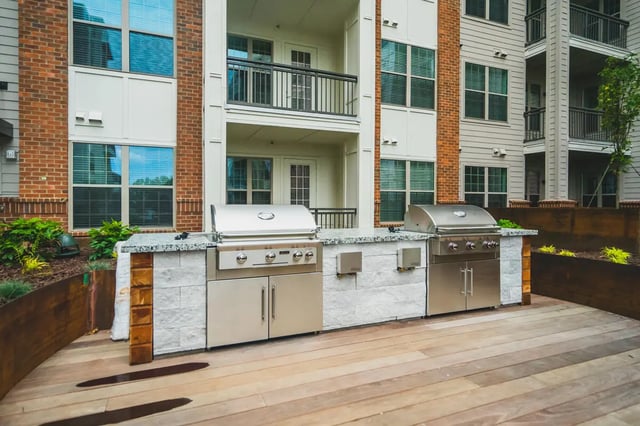 Two grills on counter with building exterior exterior at Paloma West Midtown in Atlanta Student Accommodation