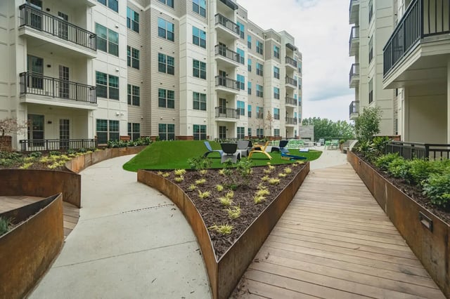 Apartment buildings with balconies and outdoor seating area Exterior at Paloma West Midtown in Atlanta Student Accommodation