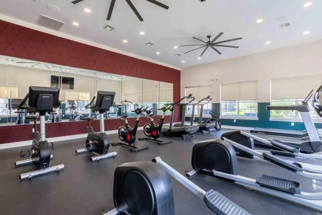 Treadmills ellipticals and stationary bikes gym at University Trails College Station in College Station Student Accommodation