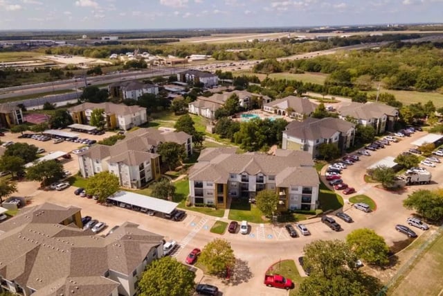 Apartment buildings and parking lots exterior at University Trails College Station in College Station Student Accommodation
