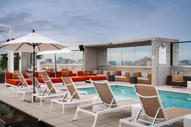 Loungers umbrellas seating and pool living room at The Carmin in Tempe Student Accommodation