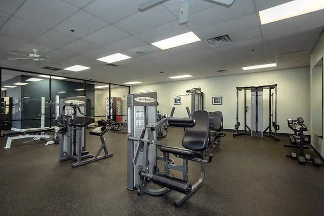 Gym equipment weights and machines fitness center at Mountain Valley Apartments in Morgantown Student Accommodation