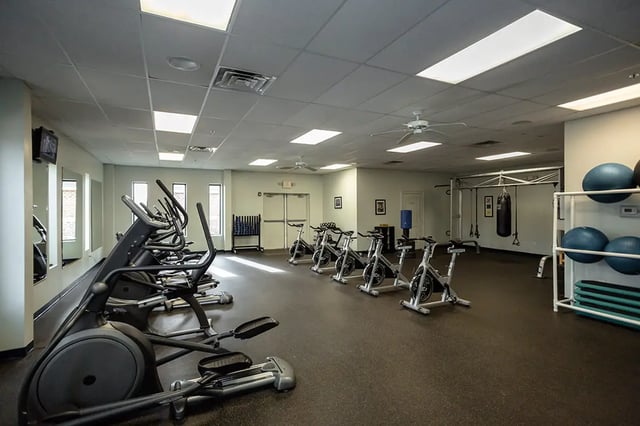 Gym with cardio machines weights and punching bag gym at Mountain Valley Apartments in Morgantown Student Accommodation