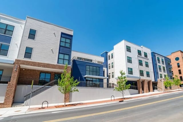 Modern apartment buildings with white and blue exteriors exterior at The Edition on Rosemary in Chapel Hill Student Accommodation