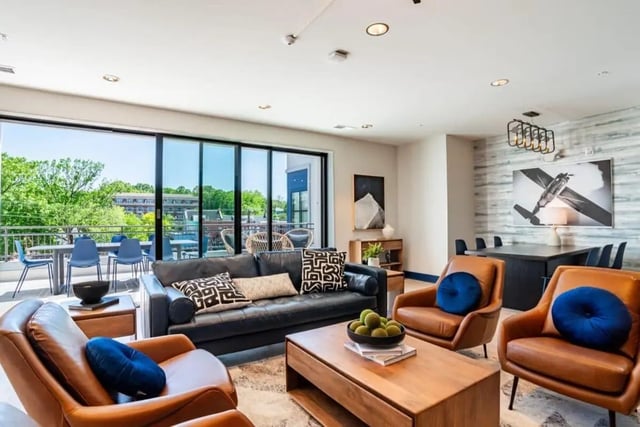 Leather couches coffee table chairs balcony living room at The Edition on Rosemary in Chapel Hill Student Accommodation