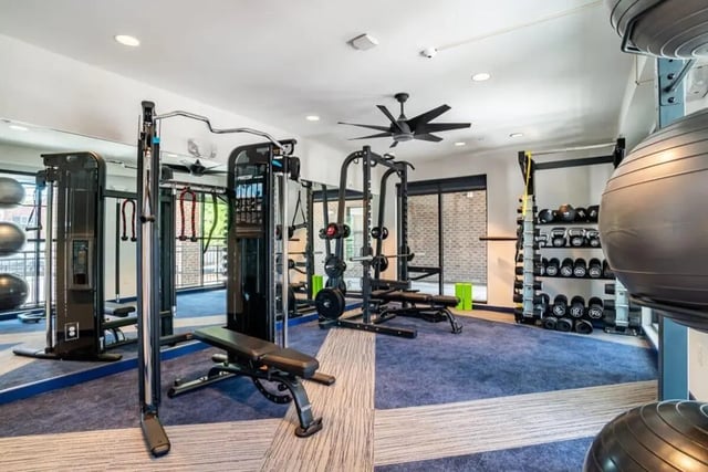 Weight racks bench gym equipment fitness center at The Edition on Rosemary in Chapel Hill Student Accommodation