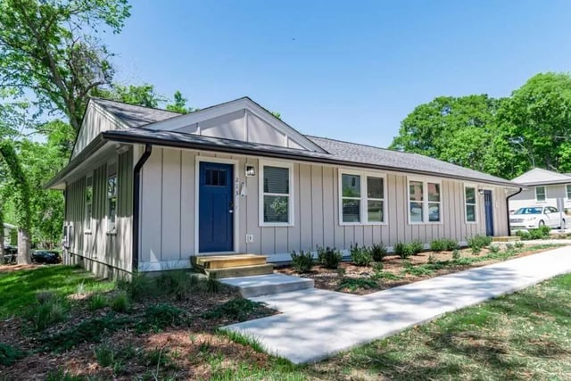 Light gray siding blue door white windows exterior at The Edition on Rosemary in Chapel Hill Student Accommodation