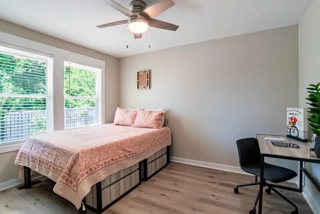 Bed desk chair with plant Bedroom at The Edition on Rosemary in Chapel Hill Student Accommodation