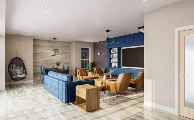 Blue sofa chairs hanging chair dining table living room at The Edition on Rosemary in Chapel Hill Student Accommodation