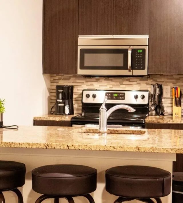 Stovetop microwave coffee maker stools kitchen at The Eleanor at Chestnut Apartments in Philadelphia Student Accommodation