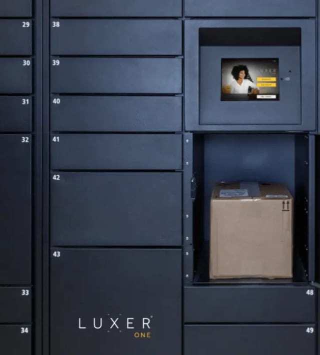 Package lockers with screen and open compartment parcel locker at The Eleanor at Chestnut Apartments in Philadelphia Student Accommodation